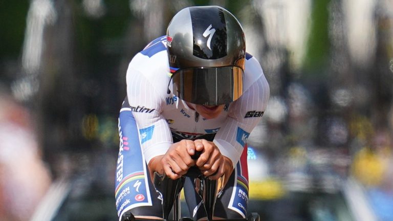 Stage winner Belgium's Remco Evenepoel strains during the seventh stage of the Tour de France cycling race, an individual time-trial over 25.3 kilometres (15.7 miles) with a start in Nuits-Saint-Georges and finish in Gevrey-Chambertin, France, Friday, July 5, 2024. (Daniel Cole/AP)