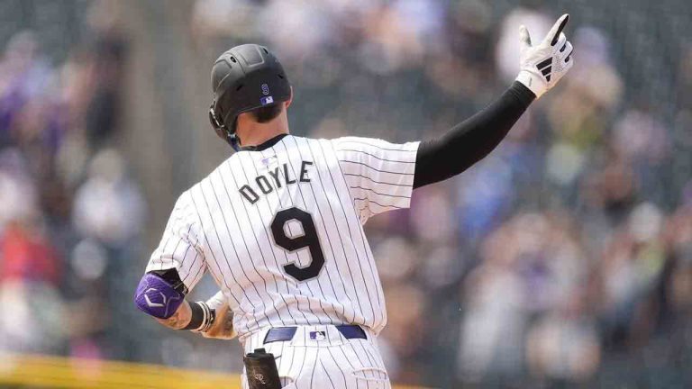 Colorado Rockies' Brenton Doyle gestures to the bullpen as he rounds the bases after hitting a grand slam off Boston Red Sox relief pitcher Chase Anderson in the sixth inning of a baseball game Wednesday, July 24, 2024, in Denver. (David Zalubowski/AP)
