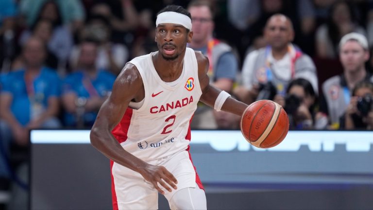 Canada's Shai Gilgeous-Alexander brings the ball down the court during the second half of a Basketball World Cup quarterfinal game against Slovenia in Manila, Philippines, Wednesday, Sept. 6, 2023. (Michael Conroy/AP)