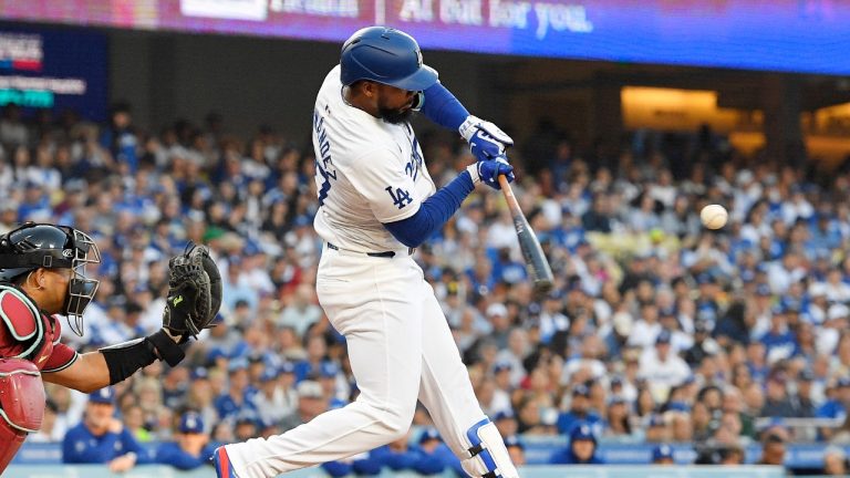 Los Angeles Dodgers' Teoscar Hernández, right, hits a solo home run as Arizona Diamondbacks catcher Gabriel Moreno watches during the first inning of a baseball game Wednesday, July 3, 2024, in Los Angeles. (Mark J. Terrill/AP)
