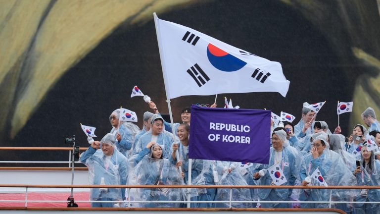 The boat carrying Team South Korea makes its way down the Seine in Paris, France, during the opening ceremony of the 2024 Summer Olympics, Friday, July 26, 2024. (Rebecca Blackwell/AP Photo)