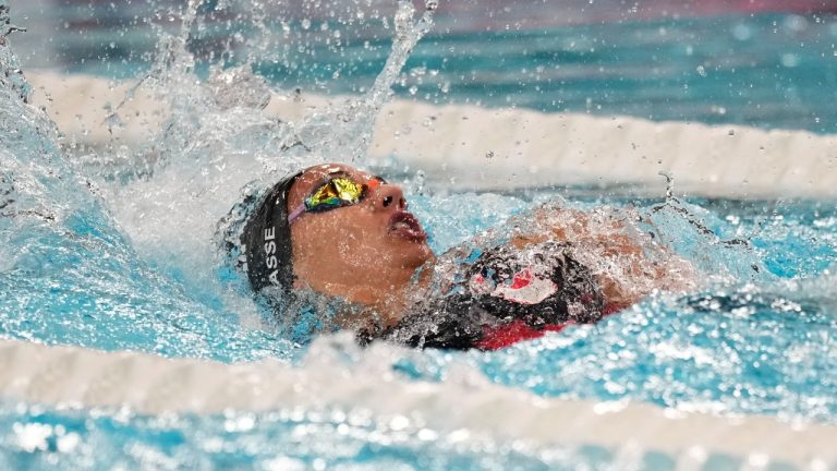 Kylie Masse, of Canada, competes during a heat in the women's 100-meter backstroke at the 2024 Summer Olympics, Monday, July 29, 2024, in Nanterre, France. (Martin Meissner/AP Photo)
