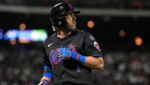 New York Mets' Jeff McNeil walks to the dugout during the eighth inning of a baseball game against the Atlanta Braves, Thursday, July 25, 2024, in New York. (Pamela Smith/AP)