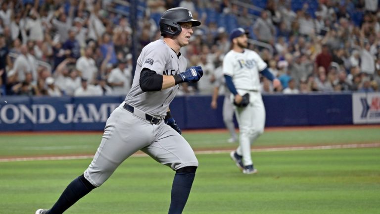 New York Yankees' Ben Rice circles the bases after hitting a two-run home run off Tampa Bay Rays reliever Colin Poche, right, during the seventh inning of a baseball game Tuesday, July 9, 2024, in St. Petersburg, Fla. (Steve Nesius/AP)