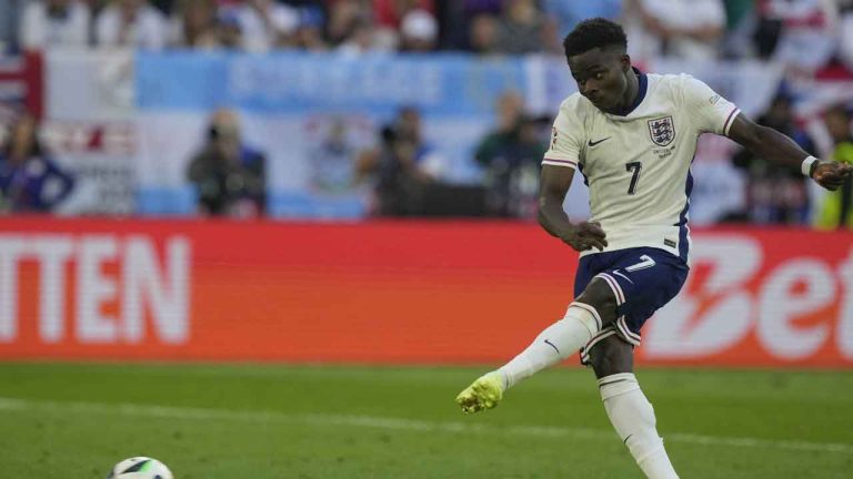 England's Bukayo Saka scores during the penalty shootout of a quarterfinal match between England and Switzerland at the Euro 2024 soccer tournament in Duesseldorf, Germany. (Martin Meissner/AP)
