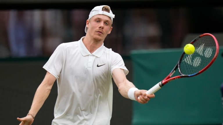 Denis Shapovalov of Canada plays a forehand return to Ben Shelton of the United States during their third round match at the Wimbledon tennis championships in London, Saturday, July 6, 2024. (Alberto Pezzali/AP)