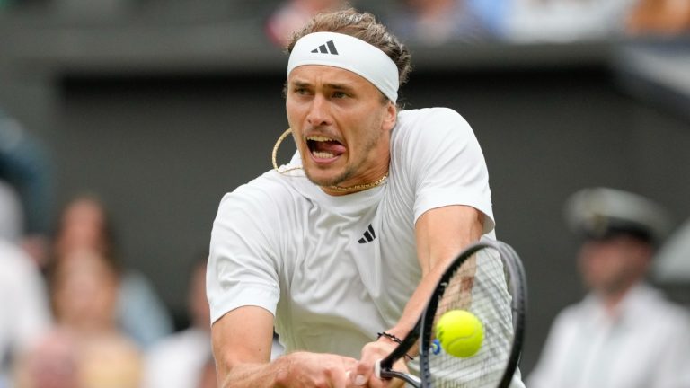 Alexander Zverev of Germany plays a backhand return to Cameron Norrie of Britain during their third round match at the Wimbledon tennis championships in London, Saturday, July 6, 2024. (Kirsty Wigglesworth/AP)