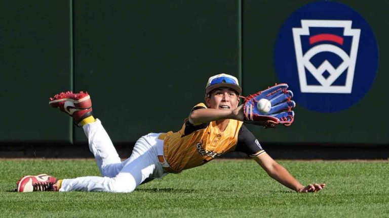 Lake Mary, Fla.'s Jacob Bibaud dives but cannot catch a fly ball by Boerne, Texas' Doc Mogford during the third inning of the United States Championship baseball game at the Little League World Series tournament in South Williamsport, Pa., Saturday, Aug. 24, 2024. Two runs scored on the hit. (Tom E. Puskar/AP)