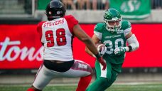 Roughriders RB becomes first professional to wear guardian cap in regular-season game