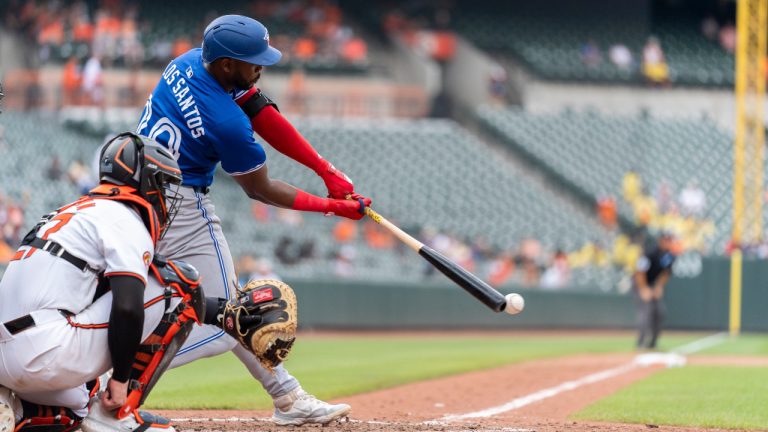 Toronto Blue Jays' Luis De Los Santos makes contact during the ninth inning of a baseball game against the Baltimore Orioles, Wednesday, July 31, 2024, in Baltimore. (Stephanie Scarbrough/AP)