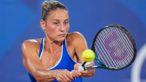 Marta Kostyuk of Ukraine returns the ball against Donna Vekic of Croatia during the women's single quarter-final tennis competition at the Roland Garros stadium, at the 2024 Summer Olympics, Wednesday, July 31, 2024, in Paris, France. (AP Photo/Manu Fernandez)