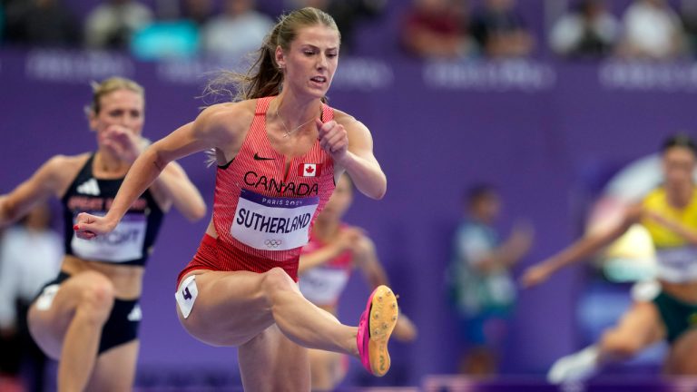 Canada's Savannah Sutherland runs in a women's 400-metre hurdles semifinal at the Summer Olympics in Paris on Tuesday, Aug. 6, 2024. (Adrian Wyld/CP)