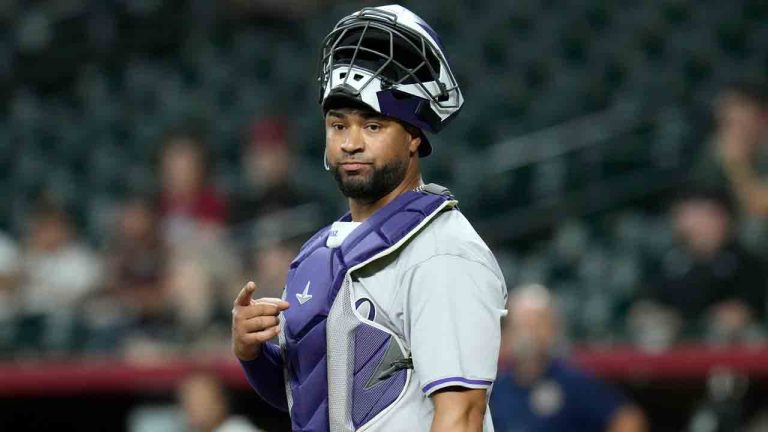 Catcher Elias Díaz pauses behind home plate during the first inning of a baseball game Monday, Aug. 12, 2024, in Phoenix. (Ross D. Franklin/AP)