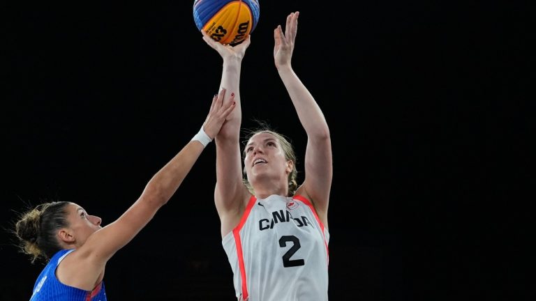 Canada's Katherine Plouffe shoots over Laetitia Guapo, of France, in the women's 3x3 pool round match during the 2024 Summer Olympics, Aug. 1, 2024.(AP Photo/Frank Franklin II)
