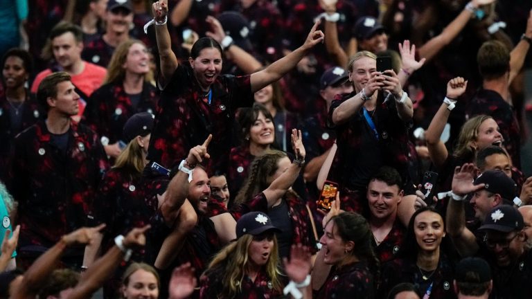 Athletes of Canada parade during the 2024 Summer Olympics closing ceremony at the Stade de France, Sunday, Aug. 11, 2024, in Saint-Denis, France. (AP/Petr David Josek)