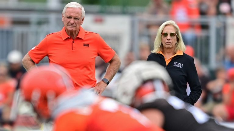 Cleveland Browns owners Jimmy Haslam, left, and Dee Haslam, right, watch during an NFL football practice in Berea, Ohio, Aug. 14, 2022. (AP Photo/David Dermer)