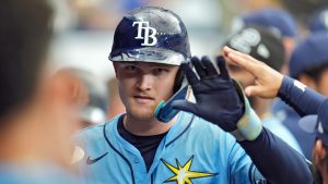 Tampa Bay Rays' Curtis Mead celebrates with teammates after his run scoring sacrifice fly off Baltimore Orioles relief pitcher Craig Kimbrel scored Brandon Lowe during the eighth inning of a baseball game Sunday, Aug. 11, 2024, in St. Petersburg, Fla. (Christopher O'Meara/AP)