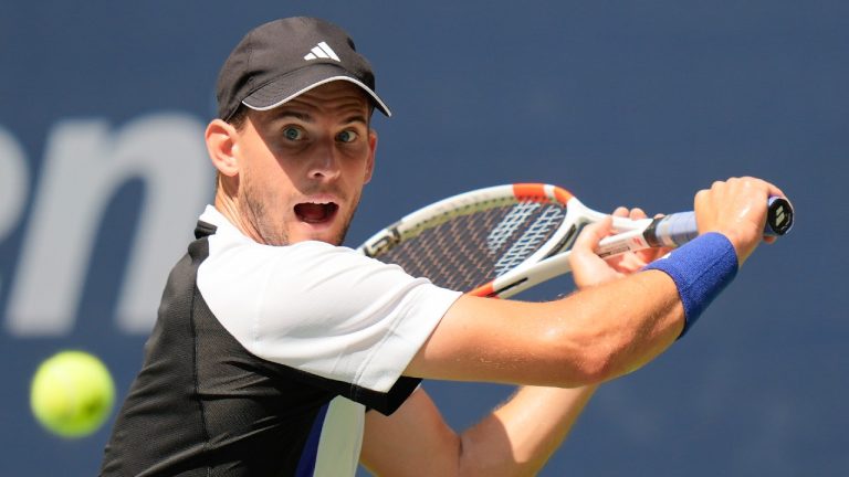 Dominic Thiem returns a shot to Ben Shelton during the first round of the US Open. (Seth Wenig/AP)