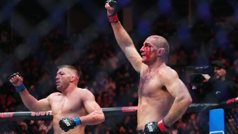Sean Strickland, right, and Dricus Du Plessis acknowledge the crowd following their tightly contested split decision middleweight title bout at UFC 297 in Toronto. Du Plessis won the fight. (Nathan Denette/CP)