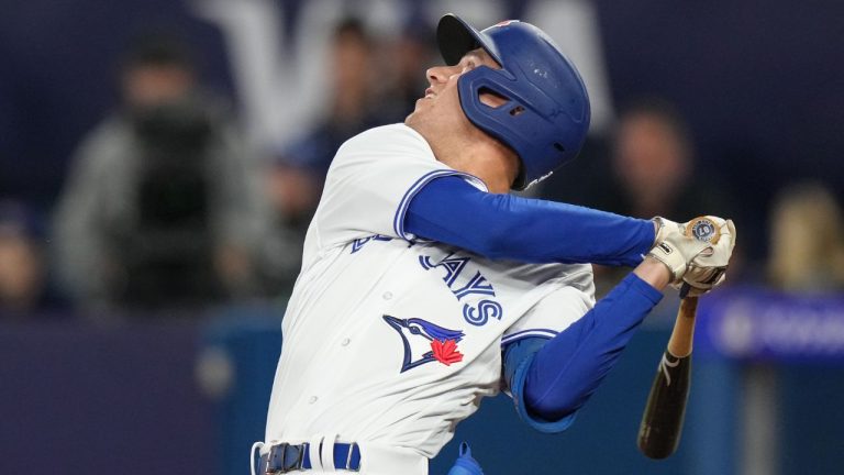 Toronto Blue Jays' Cam Eden swings as he makes his first at bat appearance during eighth inning American League MLB baseball action against Tampa Bay Rays, in Toronto, Friday, Sept. 29, 2023. (Chris Young/CP Photo)