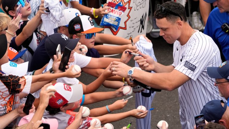 New York Yankees' Aaron Judge signs autographs for fans as the New York Yankees arrive at the Little League World Series Complex to watch the Little League World Series tournament in South Williamsport, Pa., Sunday, Aug. 18, 2024. (Tom E. Puskar/AP)