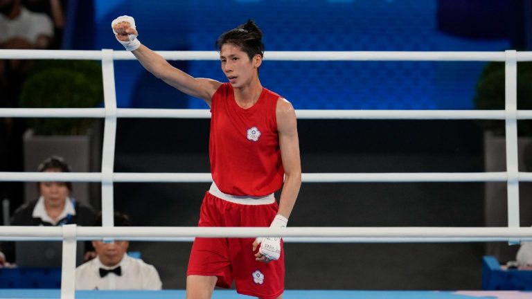 Taiwan's Lin Yu-ting celebrates after defeating Poland's Julia Szeremeta in their women's 57 kg final boxing match at the 2024 Summer Olympics, Saturday, Aug. 10, 2024, in Paris, France. (Ariana Cubillos/AP)