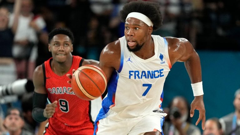 France's Guerschon Yabusele, right, drives the court followed by Canada's RJ Barrett during a men's quarterfinal game at Bercy Arena at the 2024 Summer Olympics, Tuesday, Aug. 6, 2024, in Paris, France. (Michael Conroy/AP)