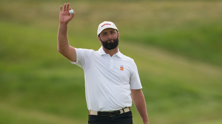 Jon Rahm, of Spain, acknowledges the crowd after completing his round on the 18th green during the third round of the men's golf event at the 2024 Summer Olympics, Saturday, Aug. 3, 2024, at Le Golf National in Saint-Quentin-en-Yvelines, France. (Matt York/AP)