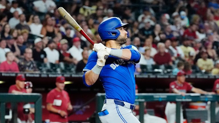 Toronto Blue Jays' Kevin Kiermaier watches the flight of his grand slam against the Arizona Diamondbacks, July 14, 2024. (AP Photo/Ross D. Franklin)