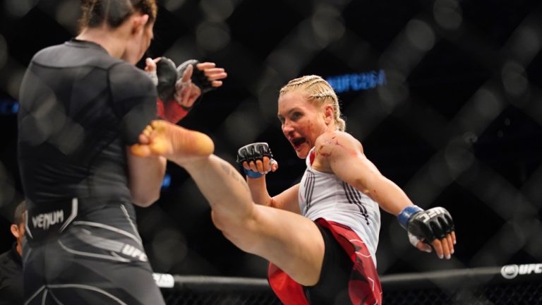 Yana Kunitskaya kicks Irene Aldana at UFC 264. (John Locher/AP)