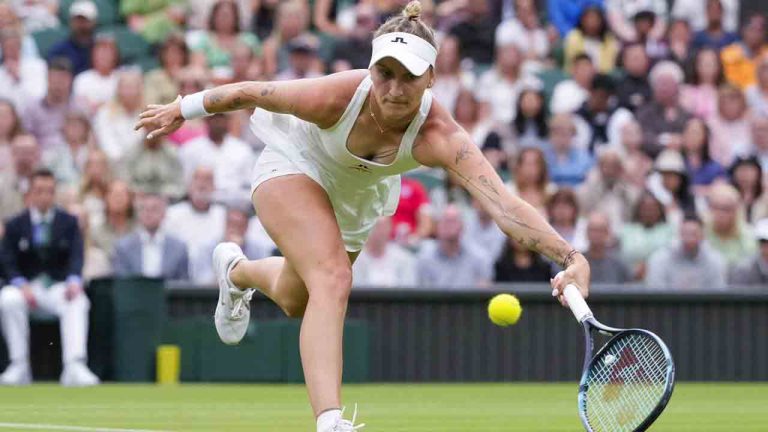 Marketa Vondrousova of the Czech Republic plays a forehand return to Jessica Bouzas Maneiro of Spain during their first round match at the Wimbledon tennis championships in London, July 2, 2024. (Kirsty Wigglesworth/AP)