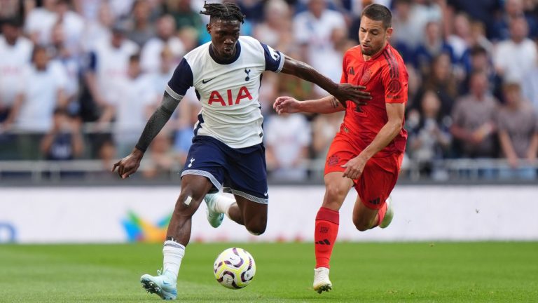Tottenham Hotspur's Yves Bissouma, left, and Bayern Munich's Jamal Musiala challenge for the ball during the friendly soccer match between Tottenham Hotspur and Bayern Munich, at the Tottenham Hotspur Stadium, London, Saturday, August 10, 2024. (Bradley Collyer/PA via AP)