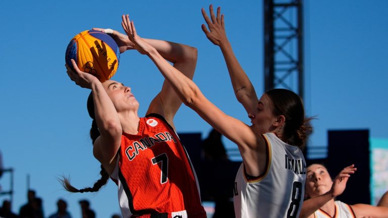 Canada's Paige Crozon (7) shoots over Germany's Elisa Mevius (8) during a women's 3x3 basketball semifinal game at the 2024 Summer Olympics, Monday, Aug. 5, 2024, in Paris, France. (Frank Franklin II/AP Photo)