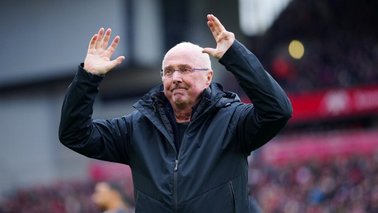Former England manager Sven-Goran Eriksson gestures to the crowd before the start of an exhibition soccer match between Liverpool Legends and Ajax Legends at Anfield Stadium, Liverpool, England, Saturday March 23, 2024. (Jon Super/AP Photo)