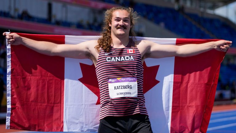 Ethan Katzberg of Canada celebrates after his second place finish in the men's hammer throw final during the athletics in the Alexander Stadium at the Commonwealth Games in Birmingham, England, Saturday, Aug. 6, 2022. (Alastair Grant/AP Photo)