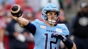 Toronto Argonauts quarterback Chad Kelly (12) makes the pass during first half CFL Eastern Division final football action against the Montreal Alouettes, in Toronto, Saturday, Nov. 11, 2023. (Frank Gunn/CP)
