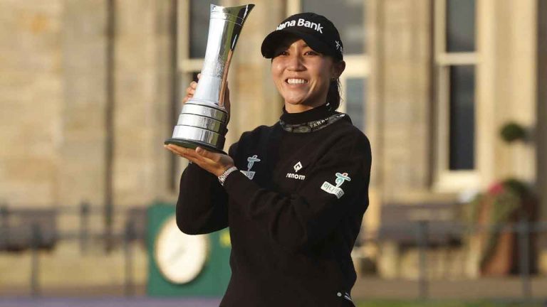 Lydia Ko of New Zealand, poses for the media with the trophy for winning the Women's British Open golf championship, and becoming Champion golfer, in St. Andrews, Scotland. (Scott Heppell/AP)
