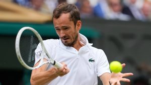 Daniil Medvedev of Russia plays a forehand return to Carlos Alcaraz of Spain during their semifinal match at the Wimbledon tennis championships in London, Friday, July 12, 2024. (Kirsty Wigglesworth/AP)