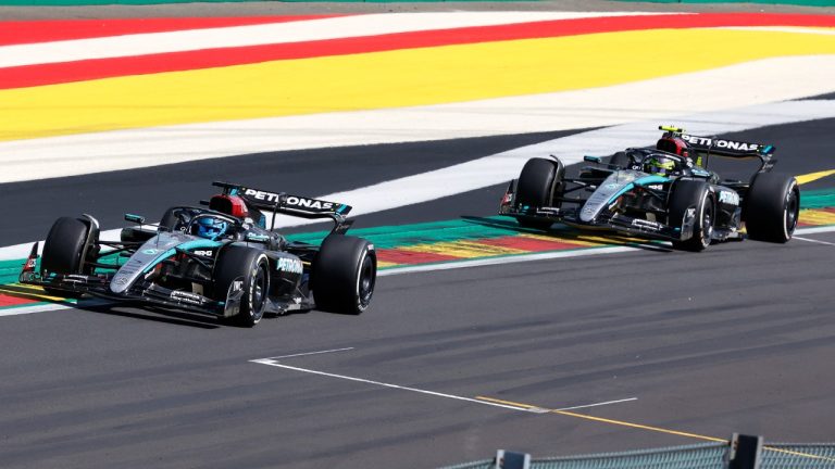 Mercedes driver George Russell of Britain, left, leads ahead of Mercedes driver Lewis Hamilton of Britain as they steer their cars during the Formula One Grand Prix at the Spa-Francorchamps racetrack in Spa, Belgium, Sunday, July 28, 2024. (Geert Vanden Wijngaert/AP)