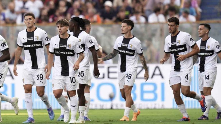 Parma's Dennis Man, center, celebrates scoring with teammates during the Serie A soccer match between Parma and Milan at Ennio Tardini Stadium. (Massimo Paolone/AP)
