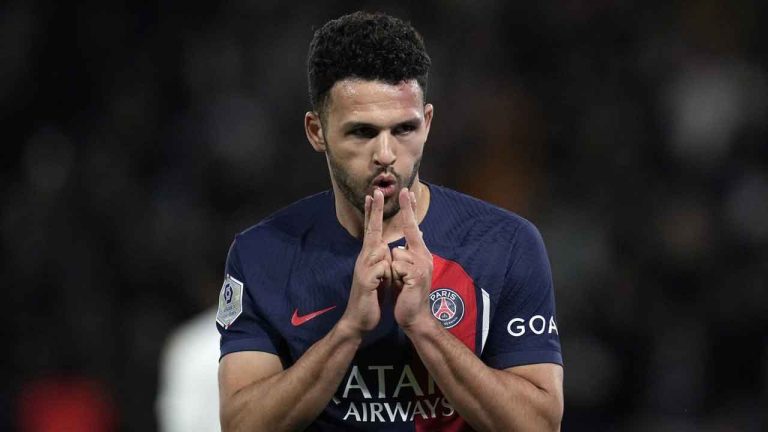 PSG's Goncalo Ramos celebrates after scoring his sides third goal during the French League One soccer match between Paris Saint-Germain and Lyon at the Parc des Princes stadium in Paris. (Christophe Ena/AP)
