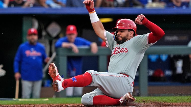 Philadelphia Phillies' Kyle Schwarber slides home to score on a double by Trea Turner during the third inning of a baseball game against the Kansas City Royals Saturday, Aug. 24, 2024, in Kansas City, Mo. (Charlie Riedel/AP)