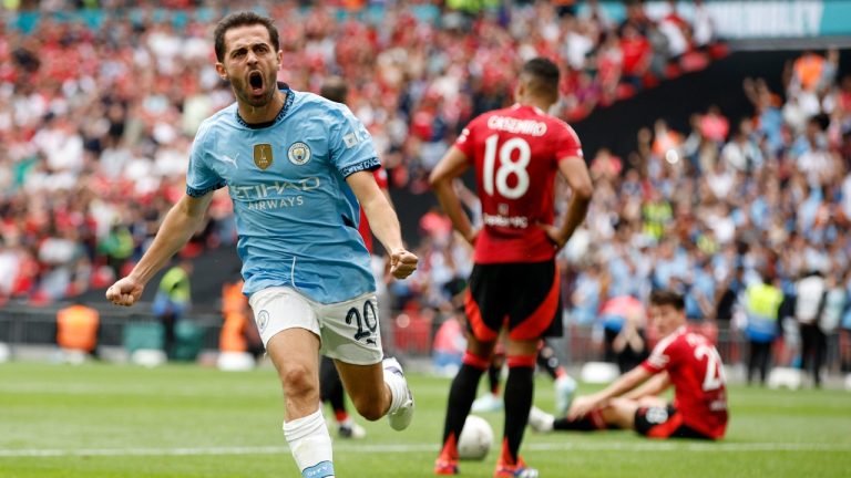 Manchester City midfielder Bernardo Silva celebrates scoring his side's first goal during the FA Community Shield soccer match between Manchester City and Manchester United at Wembley Stadium in London, Saturday, Aug. 10, 2024. (David Cliff/AP)