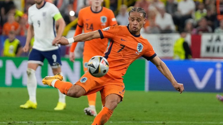 Xavi Simons of the Netherlands kicks a ball during a semifinal against England at the Euro 2024 soccer tournament in Dortmund, Germany, Wednesday, July 10, 2024. (Thanassis Stavrakis/AP)