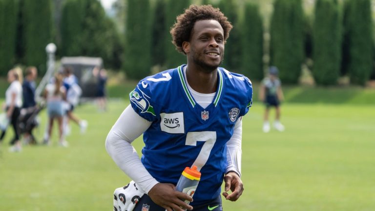 Seattle Seahawks quarterback Geno Smith jogs off the field after an NFL training camp practice, Saturday, July 27, 2024, in Renton, Wash. (Stephen Brashear/AP)