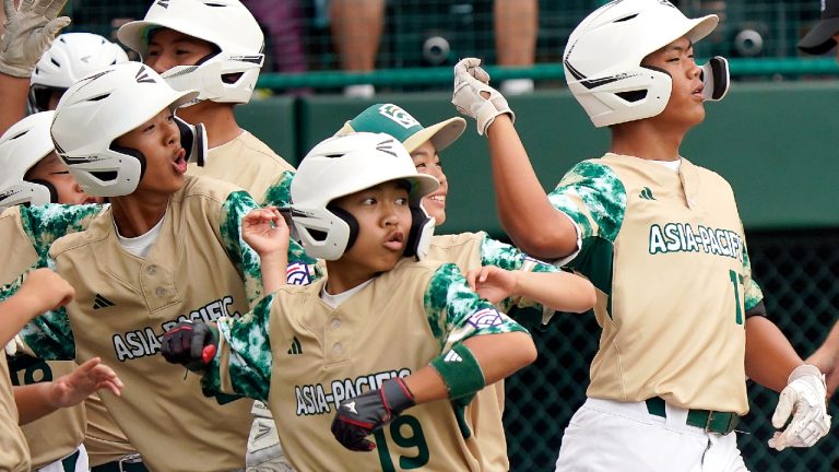 Taiwan's Fan Chen-Jun (17), right, celebrates with his teammates on his way back to the dugout after his three run home run off of Needville, Texas' Colten Georgi during the third inning of a baseball game at the Little League World Series tournament in South Williamsport, Pa., Sunday, Aug. 27, 2023. (Tom E. Puskar/AP)