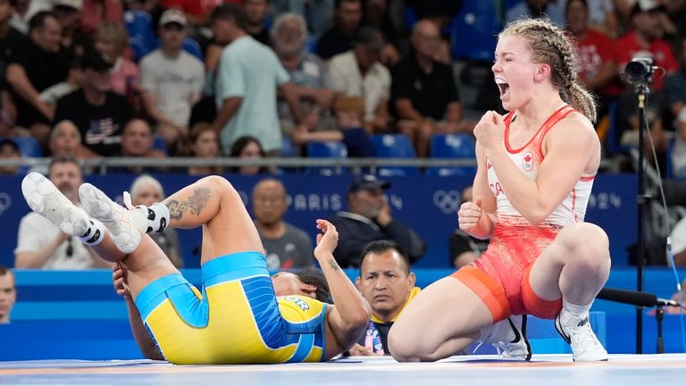 Canada's Hannah Fay Taylor celebrates after defeating Ecuador's Luisa Elizabeth Valverde Melendres during their women's freestyle 57kg repechage wrestling match, at Champ-de-Mars Arena, during the 2024 Summer Olympics, Friday, Aug. 9, 2024, in Paris, France. (Eugene Hoshiko/AP Photo)