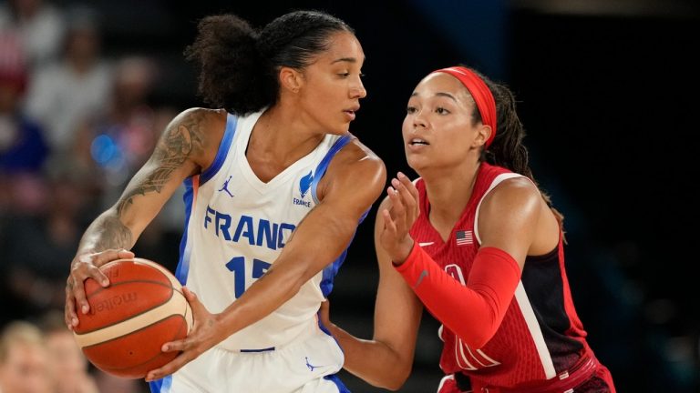 Gabby Williams (15), of France, tries to get past United States' Napheesa Collier (11) during a women's gold medal basketball game at Bercy Arena at the 2024 Summer Olympics, Sunday, Aug. 11, 2024, in Paris, France. (Michael Conroy/AP)