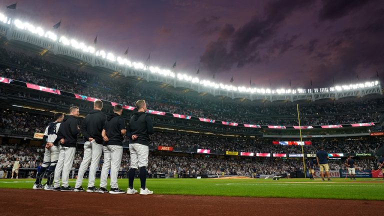 New York Yankees players stand on the field during Canada's national anthem before a baseball game against the Toronto Blue Jays, Friday, Aug. 2, 2024, in New York. (Pamela Smith/AP)