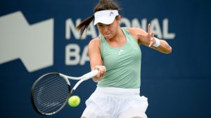 Carol Zhao, of Canada, returns the ball during a match against Amanda Anisimova, of the USA, at the National Bank Open tennis tournament in Toronto on Tuesday, Aug. 9, 2022. Zhao advanced to the Wimbledon main draw with a 7-6 (4), 6-4 win over American CoCo Vanderweghe in the third round of qualifying on Thursday. (Christopher Katsarov/CP)